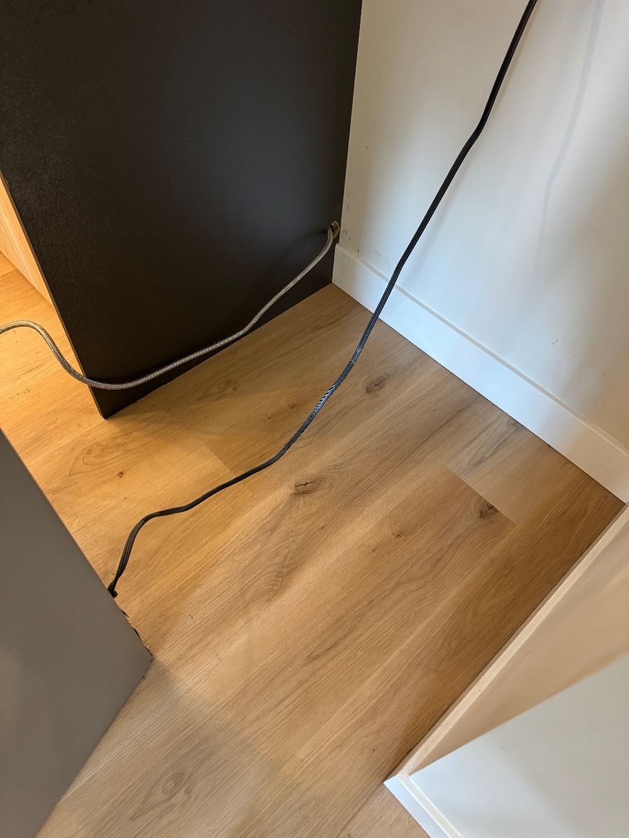 Kitchen floor by the fridge after cleaning