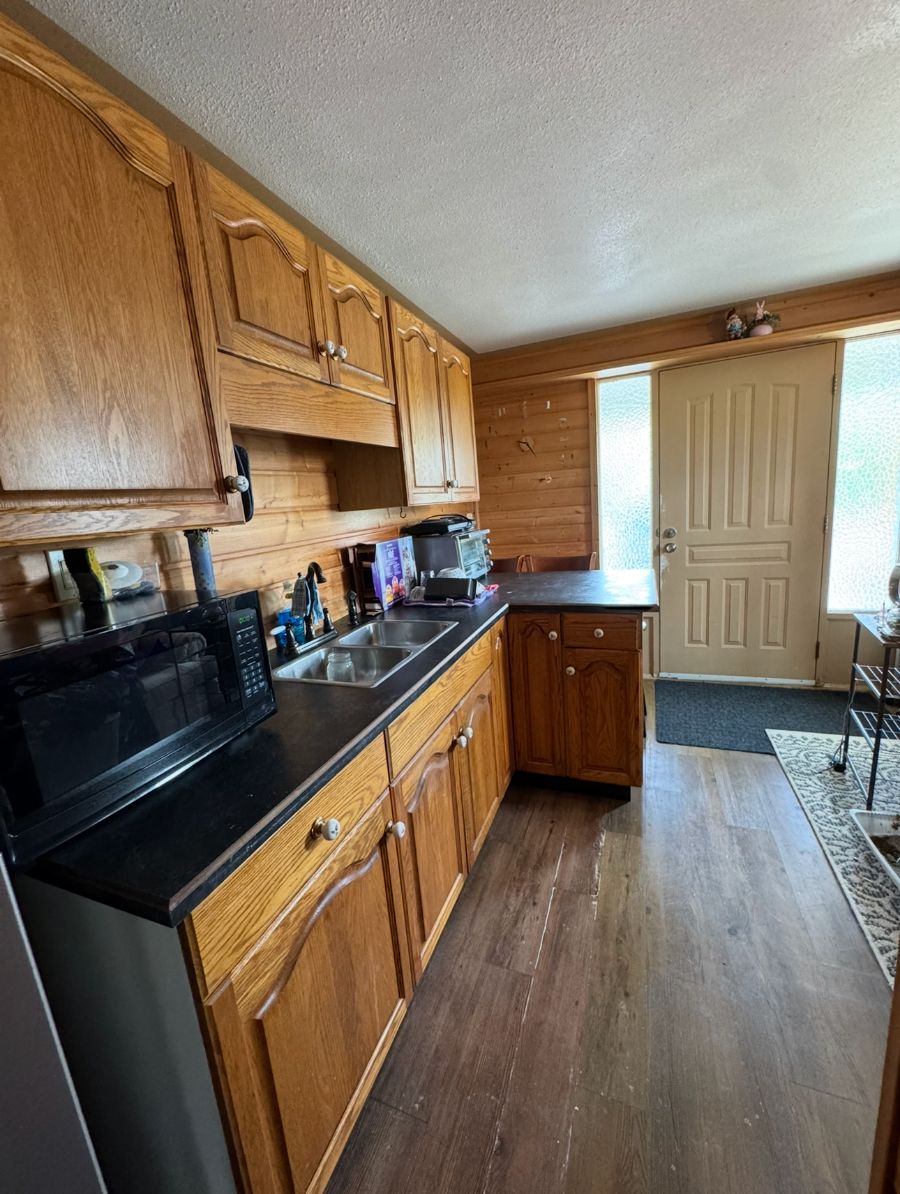 Kitchen and entryway after cleaning